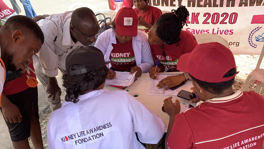 Team conducting health screening at awareness walk